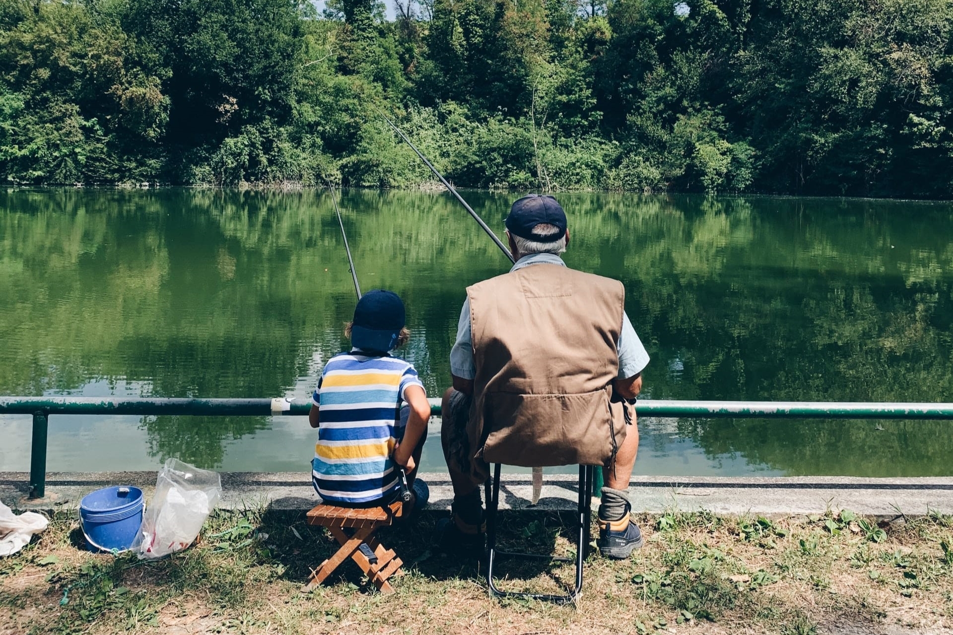 father and son fishing at a lake