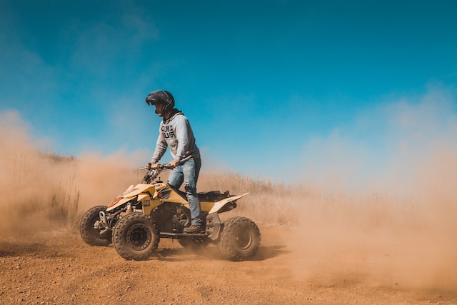 outdoor activities for team building, a man on a quad bike
