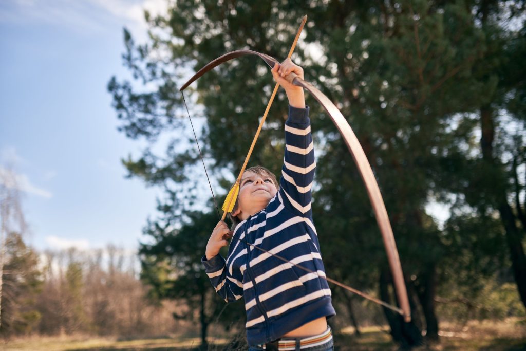 Hands-on Christmas activities - boy playing archery
