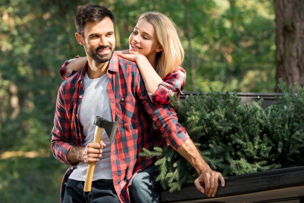 outdoor date, couple with axe outside