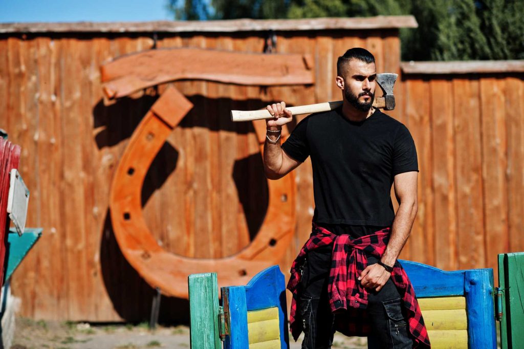 what sports make you stronger, man holding axe