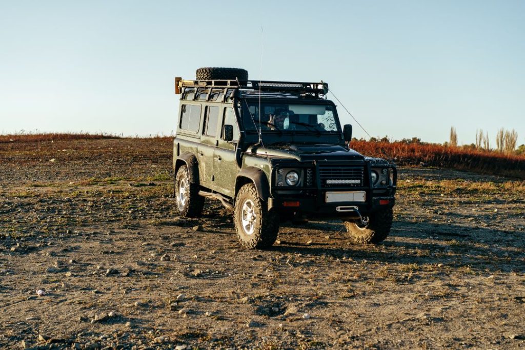 stag do activity, a 4x4 land rover parked in a meadow
