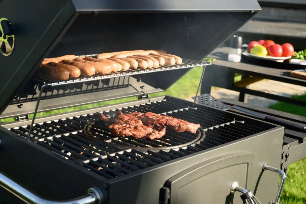 stag do venues, meat and sausage being cooked on an outdoor BBQ grill