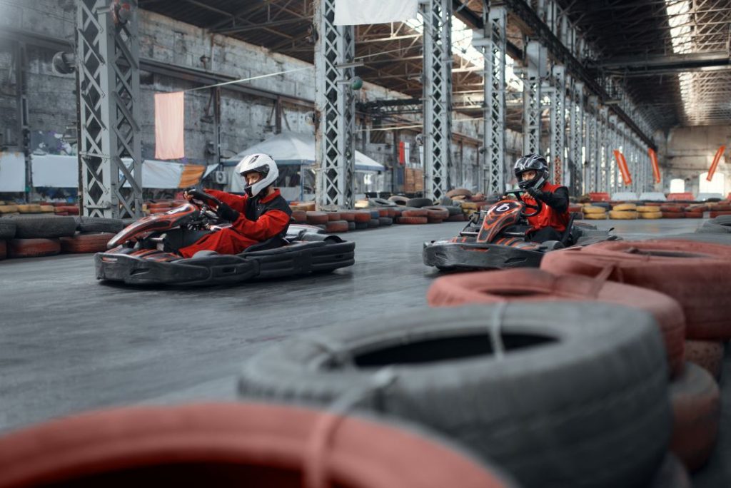 go karting vs quad biking adrenaline factor, 2 people racing in a go-karting track