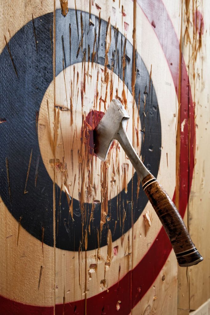 axe throwing stag do ideas UK, close up shot of a bullseye with a throwing axe