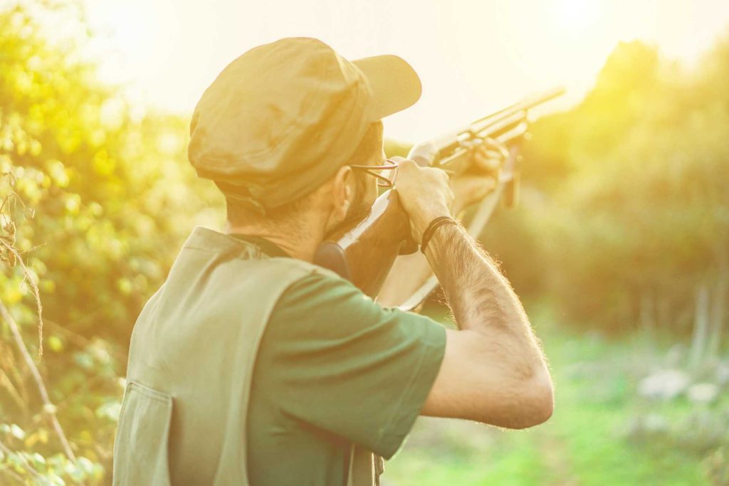 archery vs clay pigeon shooting, A man getting ready to shoot