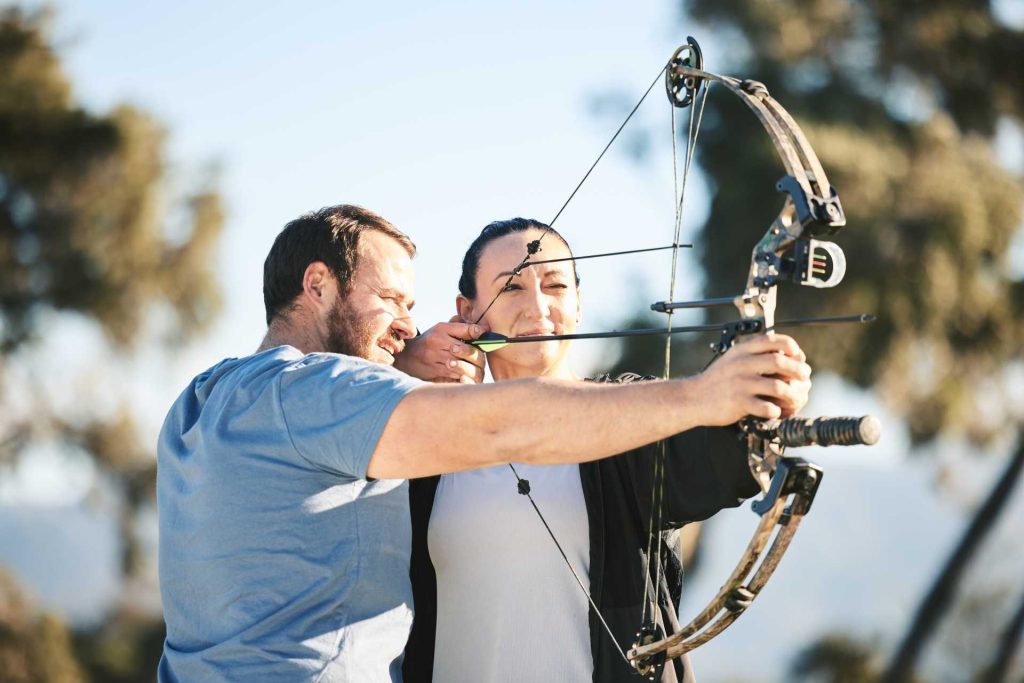 valentine's day out for couples, A couple at an archery shooting range.
