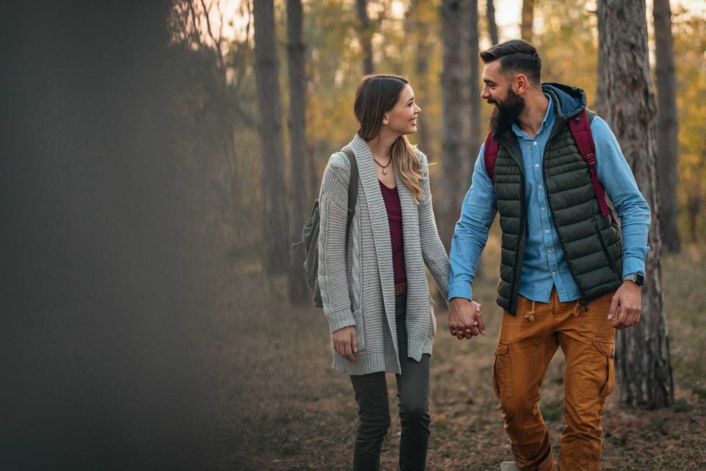 Valentine's day out ideas, a couple on a date outdoors, holding hands