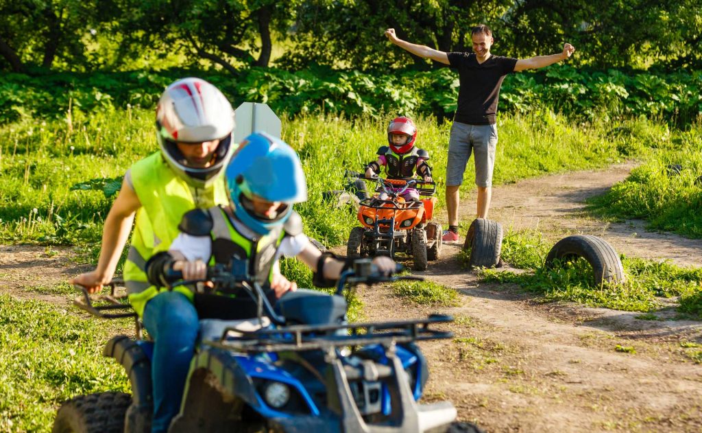 older children quad biking.