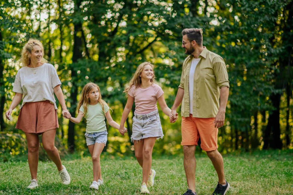 A family taking a walk in the park.