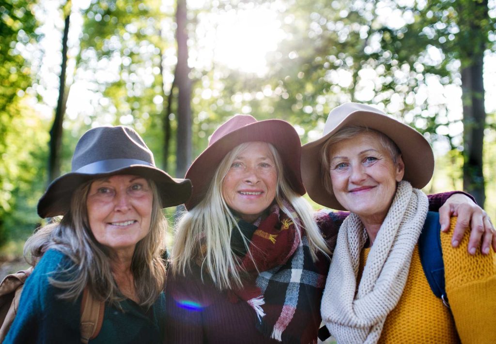 adventure vouchers uk, Senior women friends smiling in the outdoors.