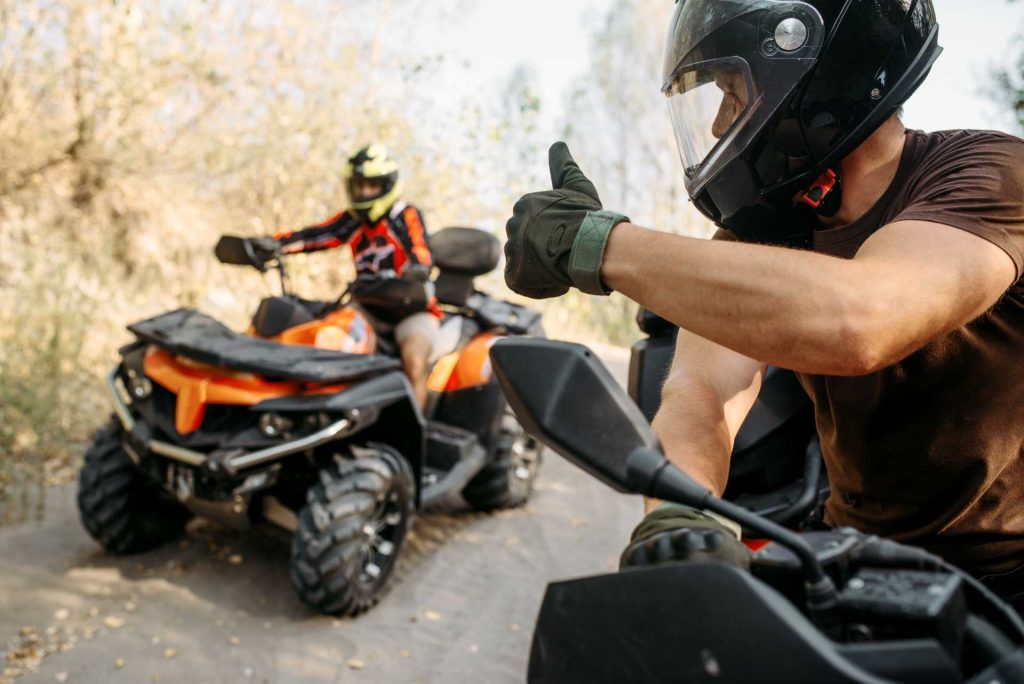 father-son outdoor activities, enthusiastic riders giving thumbsup on ATVs