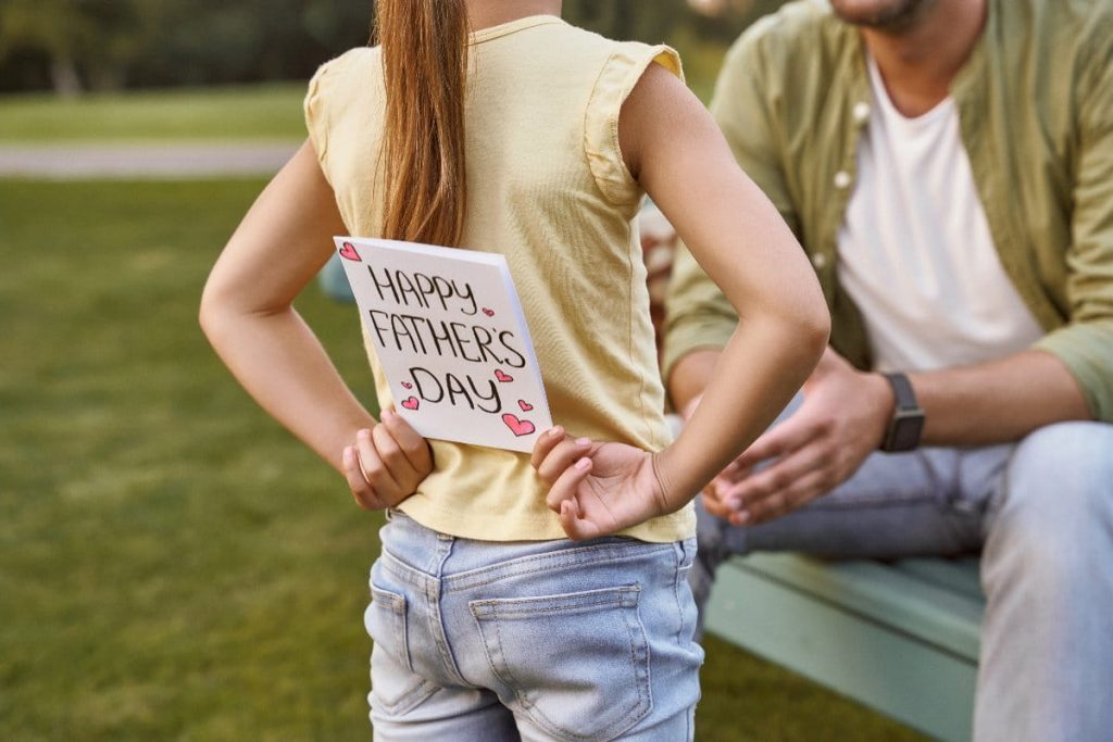 daughter with fathers day card ready to gift dad avalanche adventure activity day