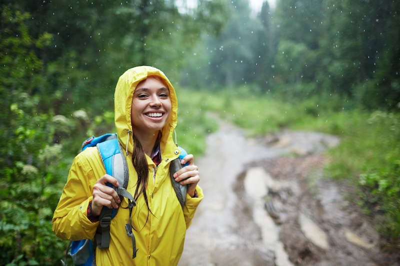Things to do when it's raining, woman outdoors in the rain.